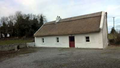 Traditional Thatched Cottage in Roscommon Ireland Rethatching Reed over Straw