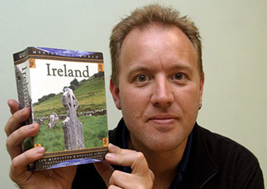 Image of Ian Middleton with one of his books.