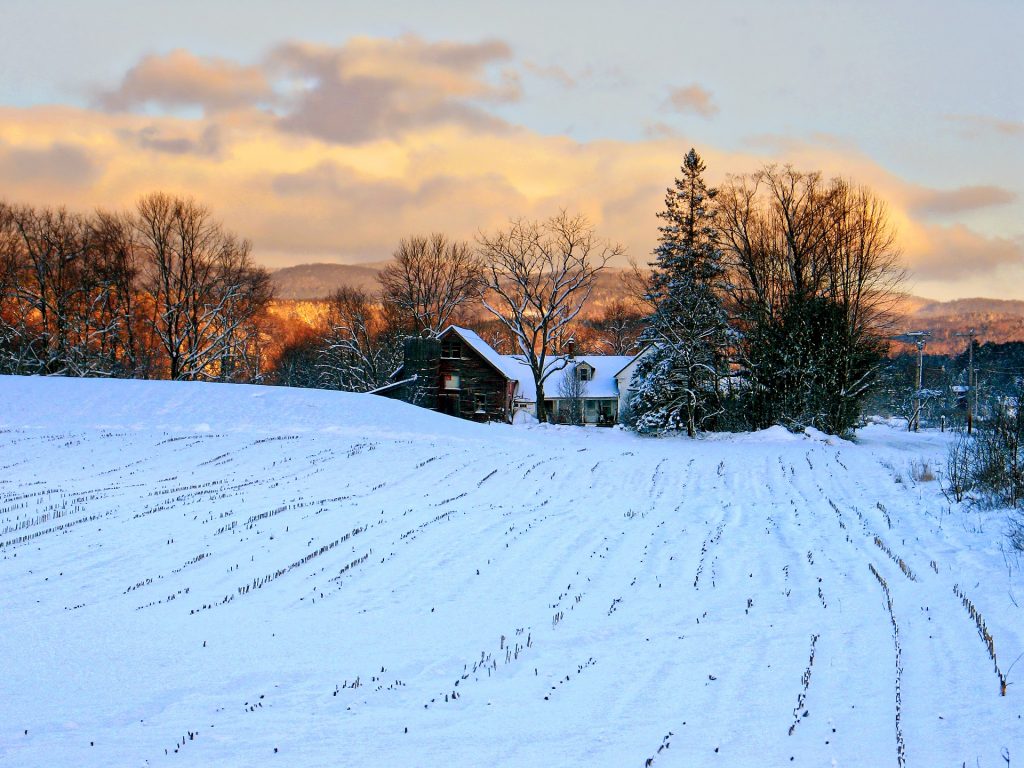 Vermont Farmhouse under a blanket of Snow